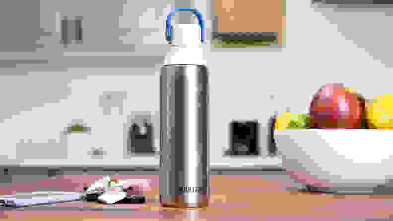 A stainless steel water bottle sitting on a kitchen counter.