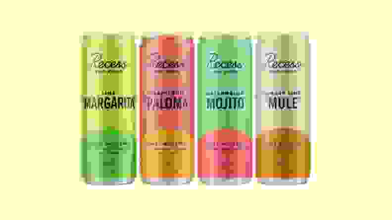 Four Recess mocktail cans on a yellow background