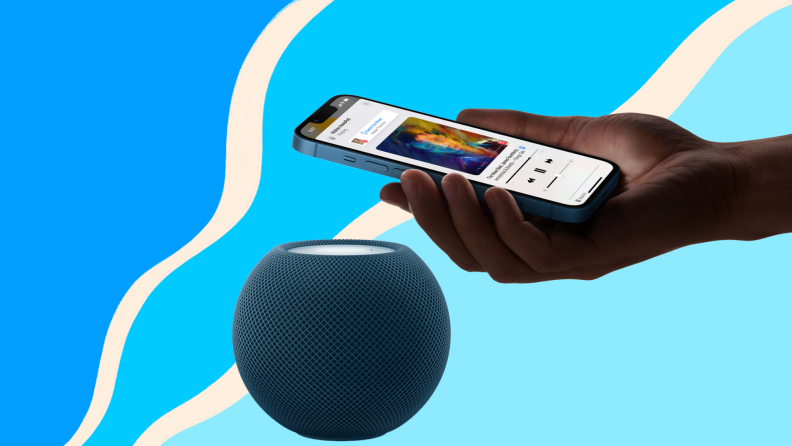 Person hovering Apple smartphone over HomePod speaker.