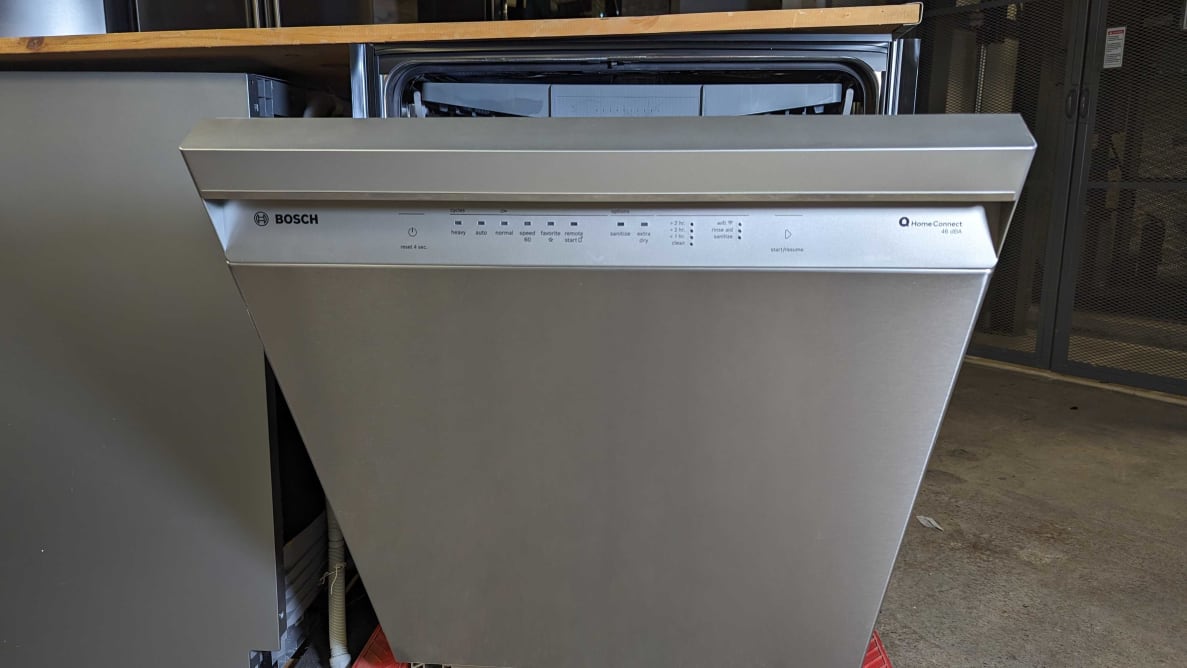 The Bosch 300 dishwasher with front-facing controls, slightly open.