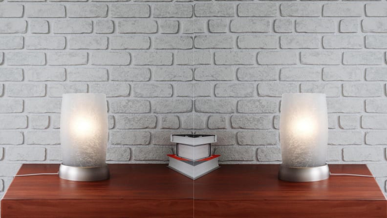The frosted glass lamp sits on a side table.
