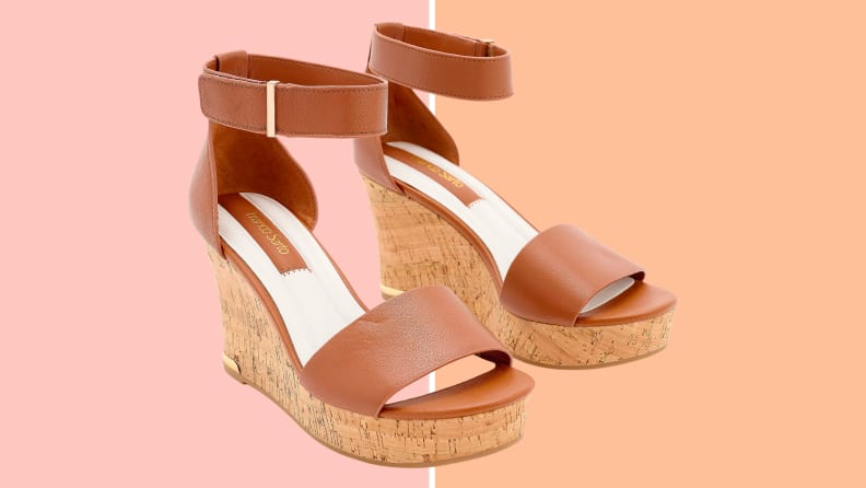 Brown Franko Sarto QVC sandals on a pink and orange background