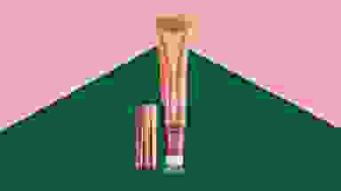 A pink tube of blush on a green and pink background.
