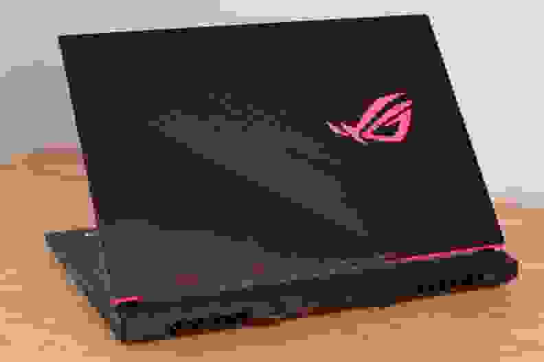 A photo of the Asus ROG Strix G512LI gaming laptop on a desk with rear ports visible