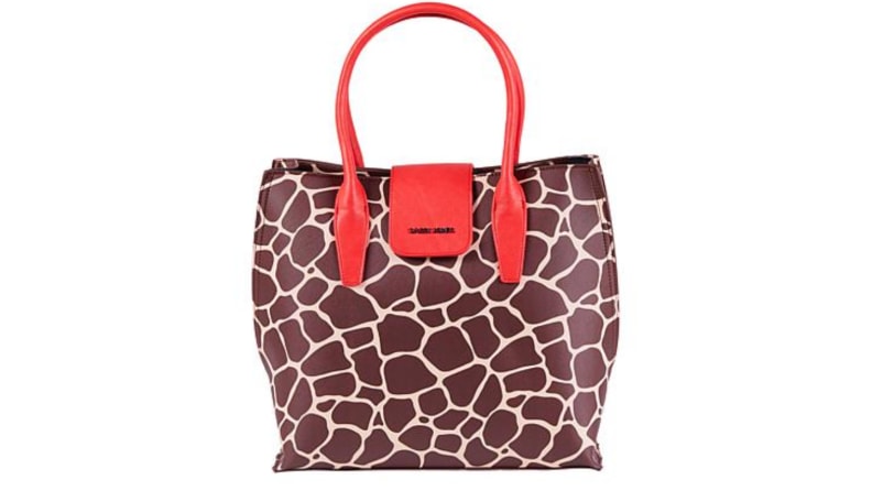 An image of a wide giraffe printed tote with red handles.