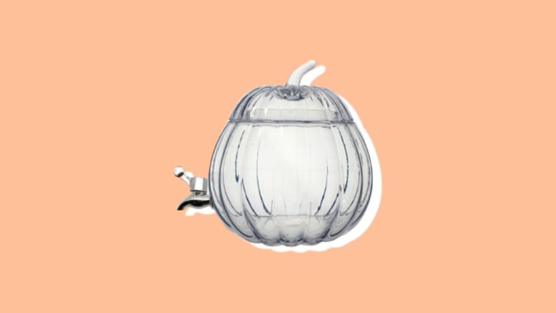 Glass pumpkin-shaped drink dispenser.