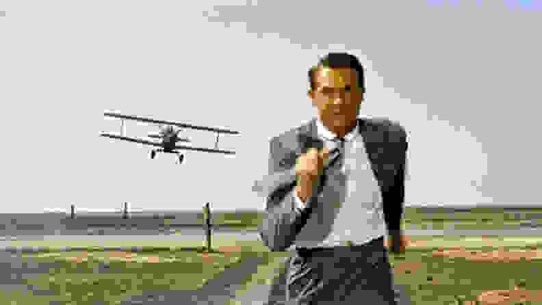 Cary Grant in "North by Northwest" (1959), one of the best thrillers to stream now, as he outruns a crop duster plane.