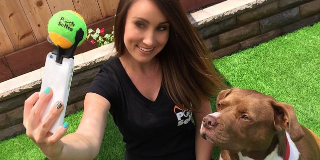 Can't get your dog to sit still for selfies? Tease him or her with this phone-mounted tennis ball!