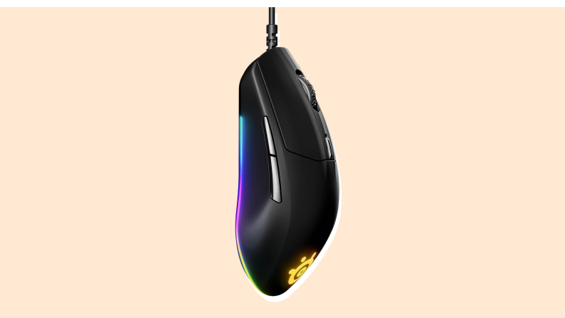 SteelSeries Rival 3 Gaming Mouse on a vanilla-colored background.