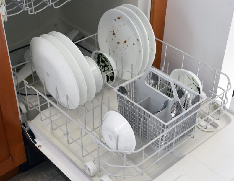 Dirty dishes on the lower rack after the wash