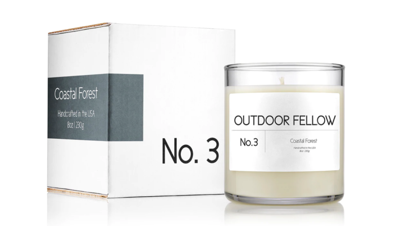 An image of the box and candle for the Coastal Forest scent from Outdoor Fellow.