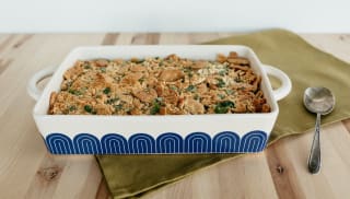 A white and blue casserole dish filled with food