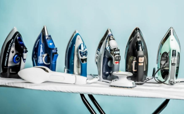 A line of steam irons on an ironing board on a blue background