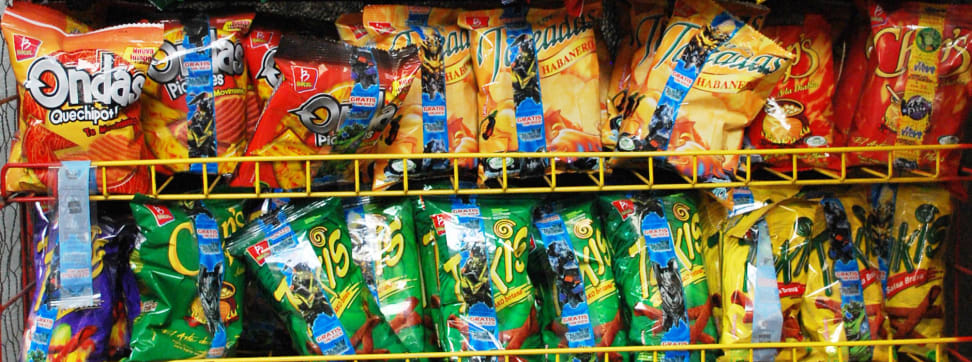 A shelf full of processed junk food.