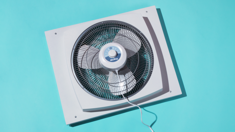 Our pick for the window fan with the best circulation, the Air King 9155, floating on a blue background.