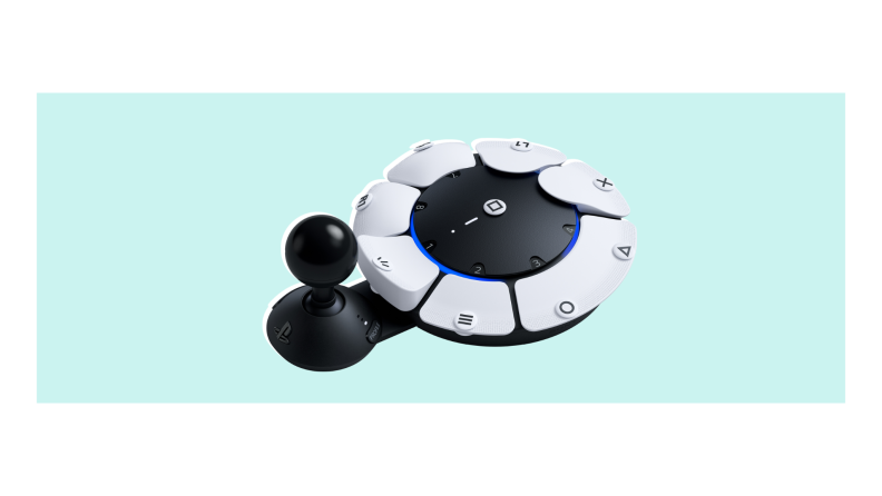 A PS5 Access Controller, with its flat disc shape and jutting joystick, in white and black.
