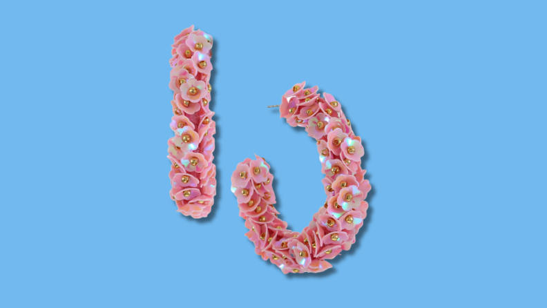 These I.N.C International Concepts Sequin Flower C-Hoop Earrings are in the color pink and bring a pop of color to any outfit.