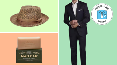 A brown braided fedora, bar of soap, and navy suit.
