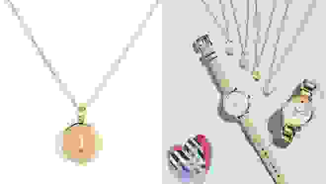 On left, gold pendant necklace with the letter "J" on front. On left, gold pendant necklaces next to watches.