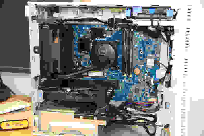 The interior of a Dell desktop tower showing the inner machinery.