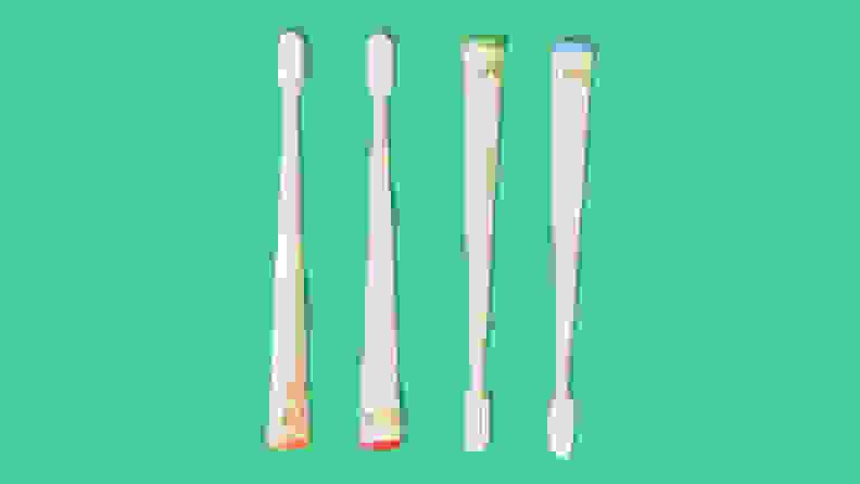 Mable sustainable toothbrushes on green background.
