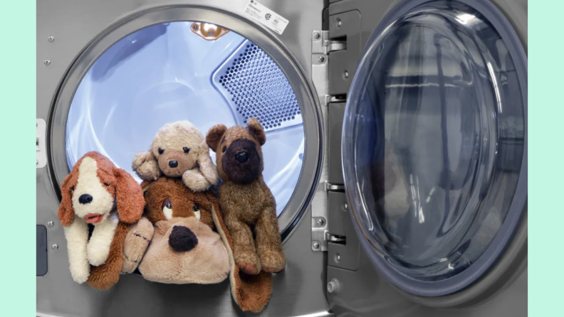 Stuffed animals in a washing machine.