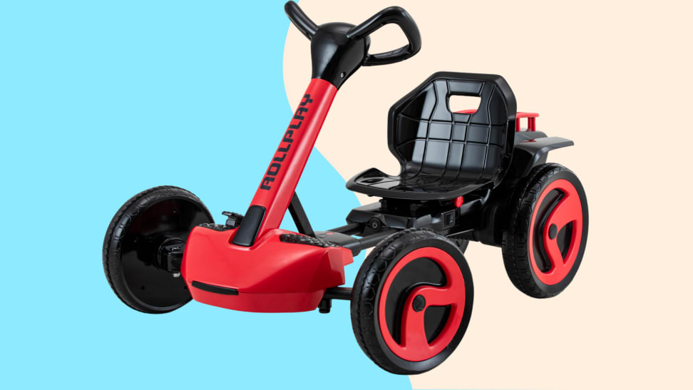A child's red ride-on toy against a blue and cream background.
