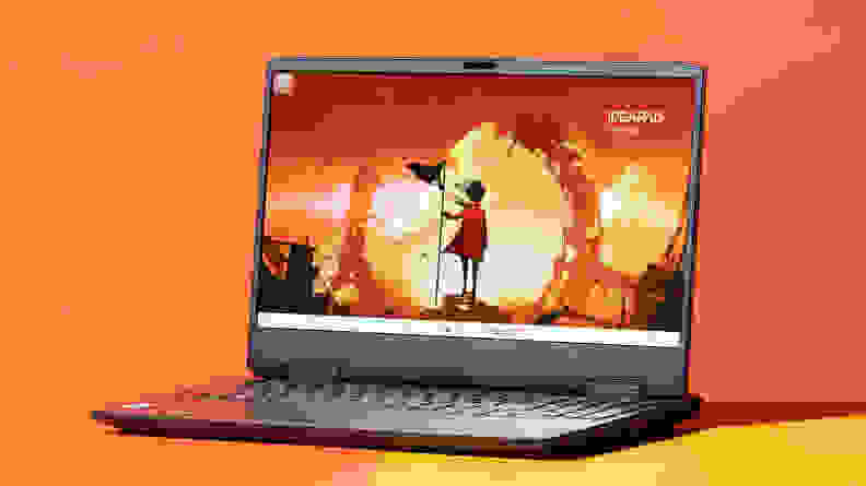 The Lenovo IdeaPad Gaming 3 on an orange background.