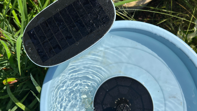 Close up of the solar panels on A Birdfy Bath Pro stands in a garden