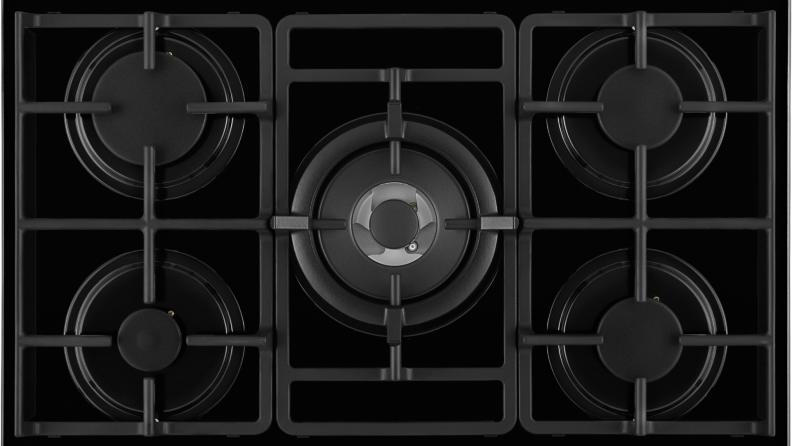 A five-burner gas cooktop show from above.