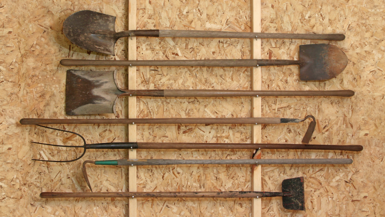 use vertical storage for tool shed organization