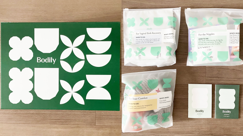 Left: The green-and-white packaging for the Body Care for Birth box. Right: Translucent white packaging for everything that's included, such as the Vaginal Birth Recovery Bundle, the For the Nipples Bundle, and more.