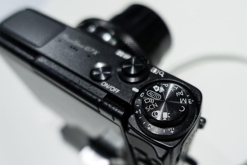 The mode dial is stacked atop the broader EV comp dial. A neat touch.