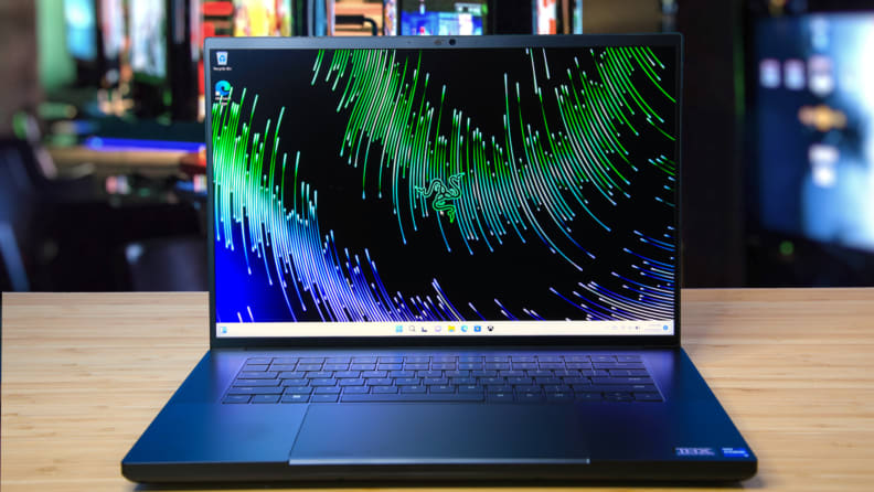 The Razer Blade 16 opened, sitting on a desk.