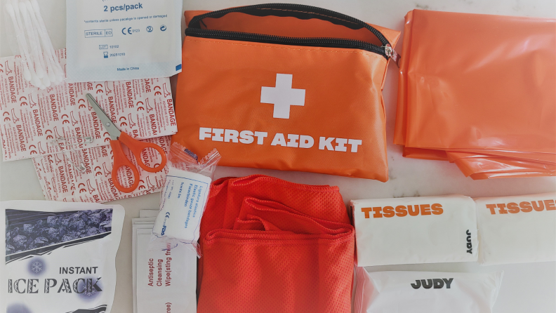 First aid kit items scattered on countertop.