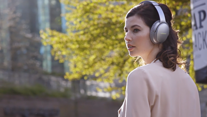 Woman wearing Bose headphones