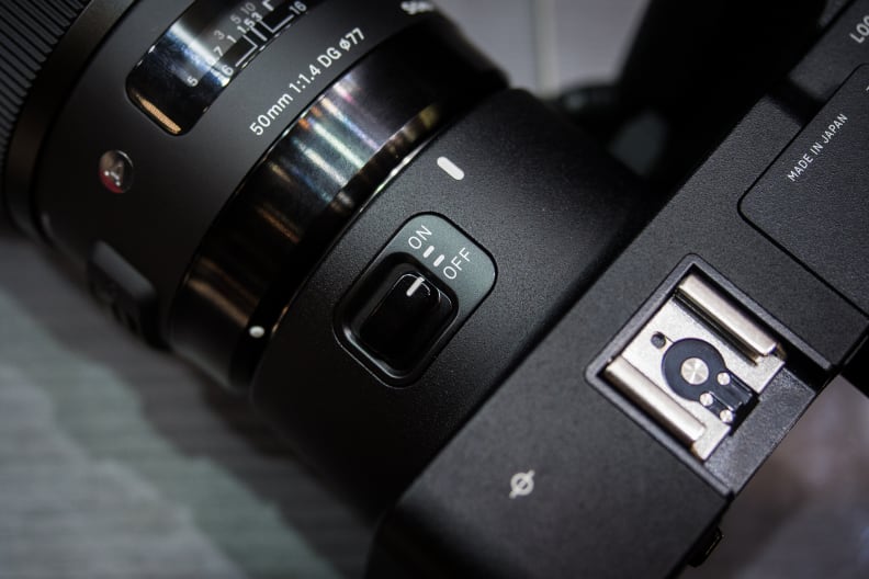The power switch is in a slightly unconventional place, on the side of the lens mount.