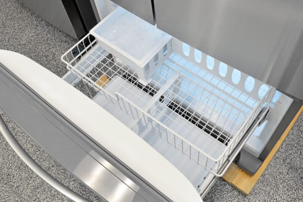 The Whirlpool WRF535SMBM's wire drawer in the freezer is one of the few visual elements in this model indicative of its lower price.