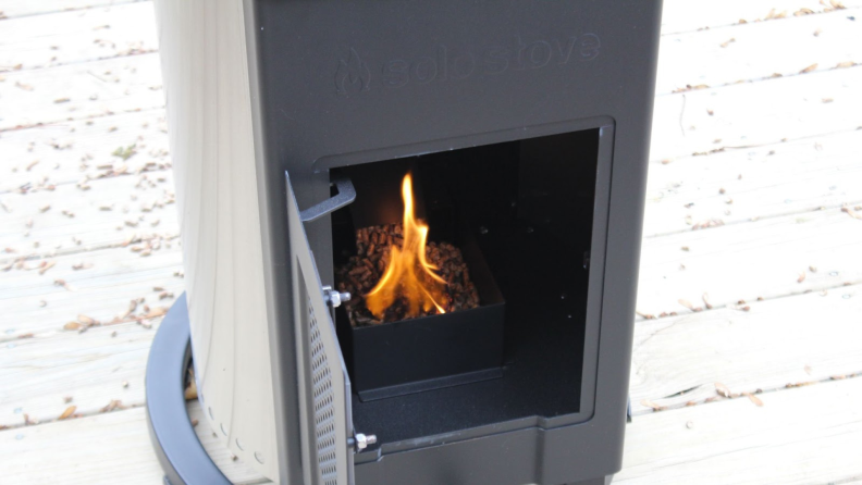 The interior of the Solo Stove Patio Heater with the wood pellets being lit.