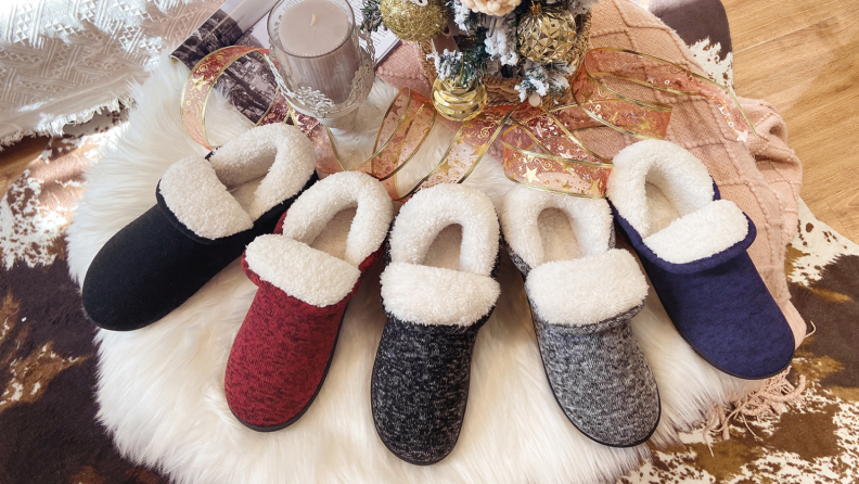 Vonmay fuzzy slippers are laid out for display in five different colors.