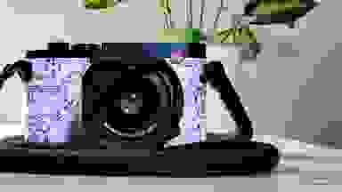 A Leica Q2 with Disney branding sitting on a desk