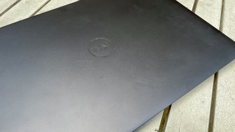 Close-up shot of the exterior of the Dell XPS 14 laptop with the Dell logo.