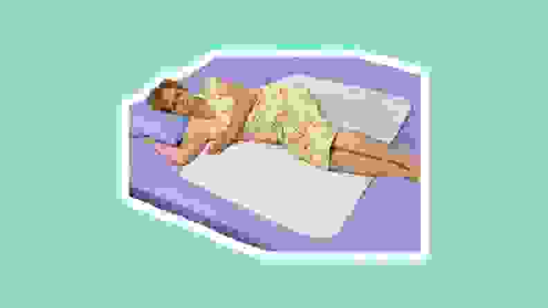 Woman sleeping on bed with white mat