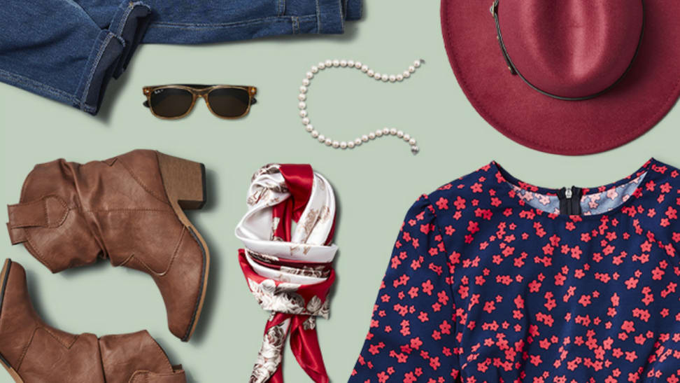 An image of a few items of clothing and accessories on a pale green background, including a hat, a pair of boots, sunglasses, a scarf, and more.