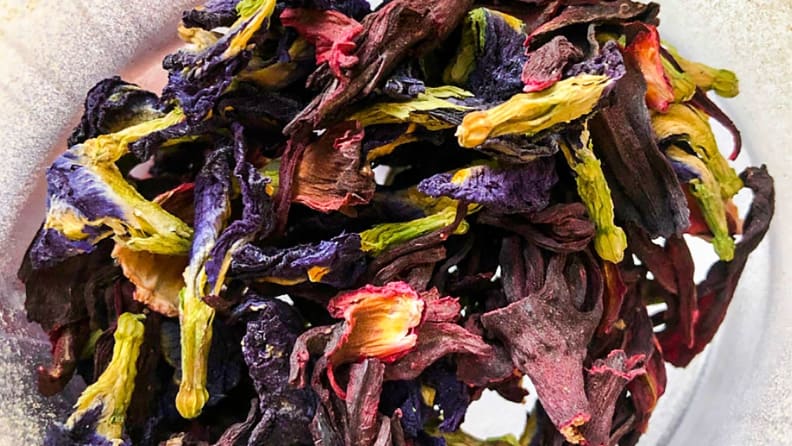 A close-up image of dried butterfly pea and hibiscus flowers.