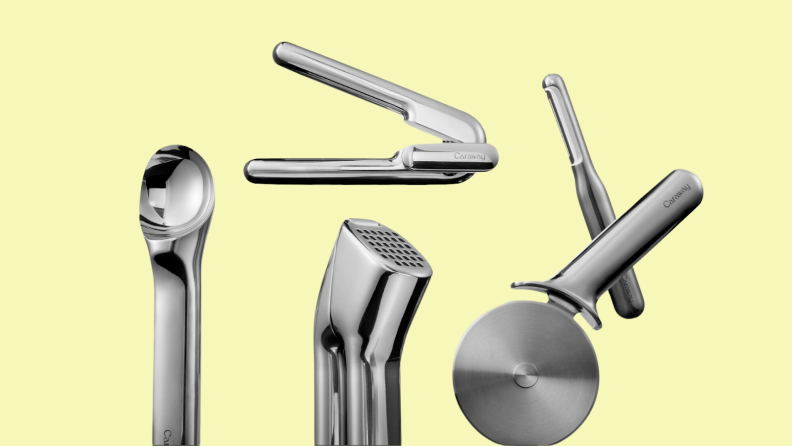 Stainless steel Caraway Kitchen Gadgets set in front of yellow background.