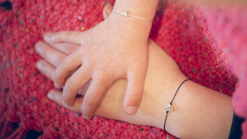 A matching bracelet keeps you close even when you're not with them.