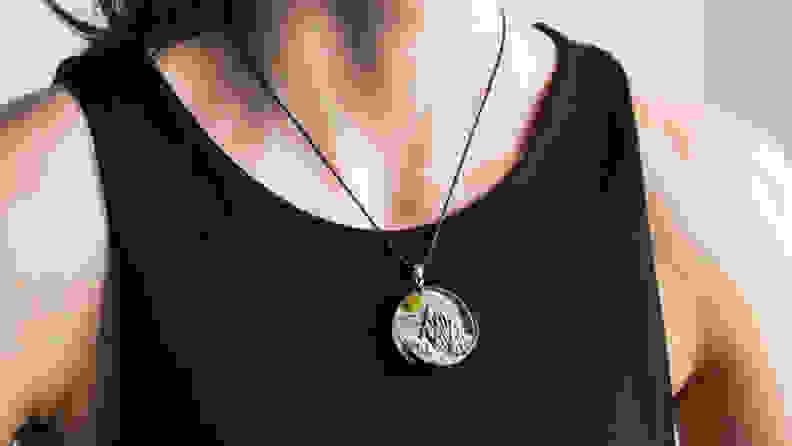 woman wearing a pendant made of resin