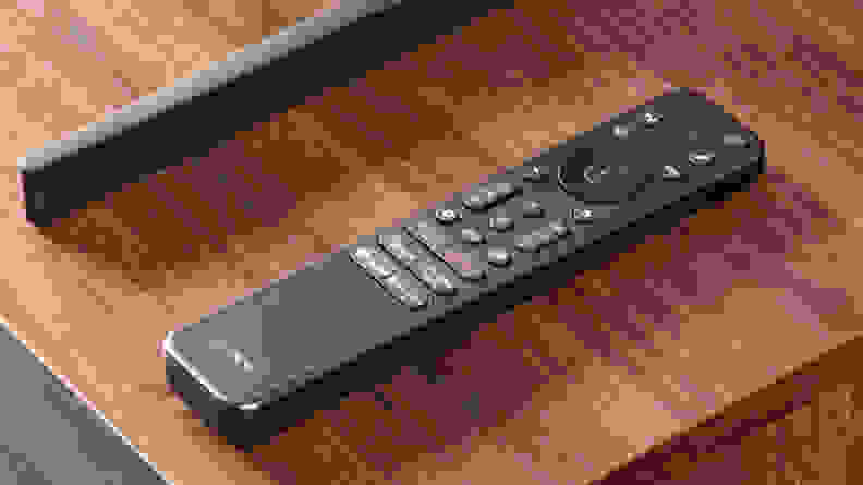 A close-up of Sony's latest remote control, placed on top of a wooden surface
