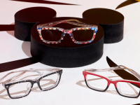 Three pairs of Pair Eyewear glasses on a black Mickey Mouse table.